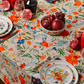 Light cream tablecloth with pomegranate and floral pattern laid flat