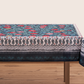 Blue tablecloth with alphabet script and pomegranate motifs on white background