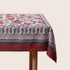 Red tablecloth with alphabet script and pomegranate motifs on white background