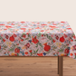 Light cream tablecloth with pomegranate and floral pattern laid flat